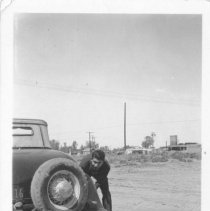 Unidentified man, strong possiblity that it is Max Thomas Sones Changing a